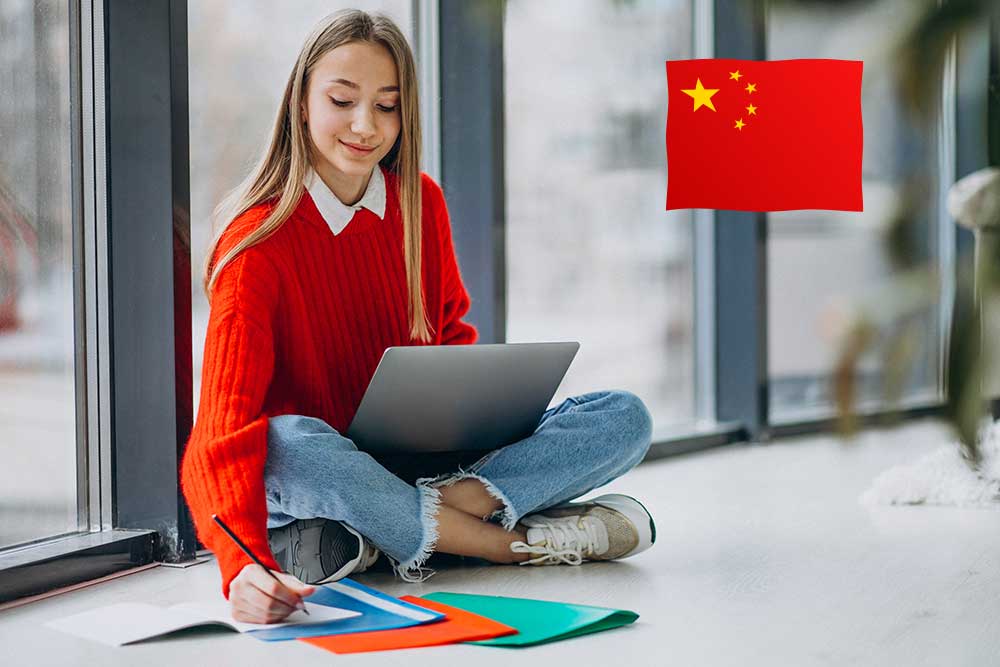 girl student studying computer by window - صفر تا صد تحصیل در چین 2021-2022
